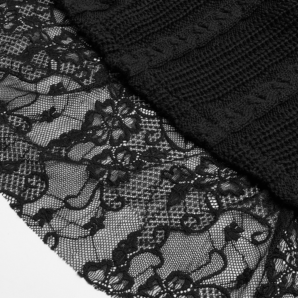 Close-up of elegant black lace detailing on gothic cardigan, showcasing intricate floral patterns and textured fabric.