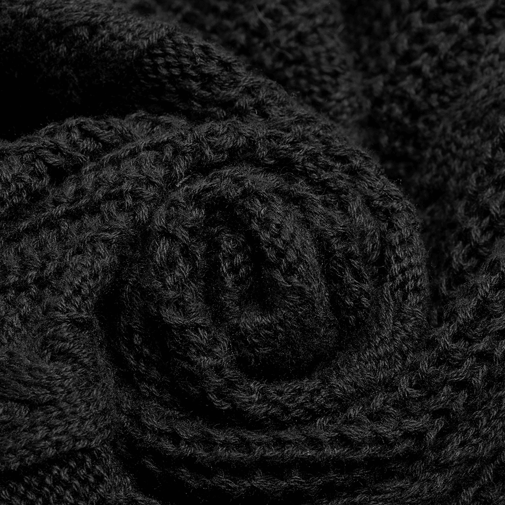 Close-up of a luxurious black woolen fabric, showcasing the intricate texture of the stylish hooded gothic cardigan.