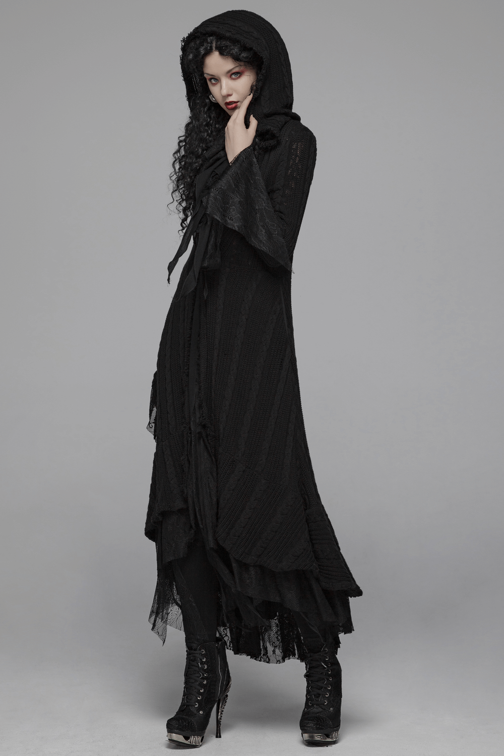 Elegant hooded gothic cardigan with lace details, showcasing a fitted silhouette and dramatic design for a stylish look.