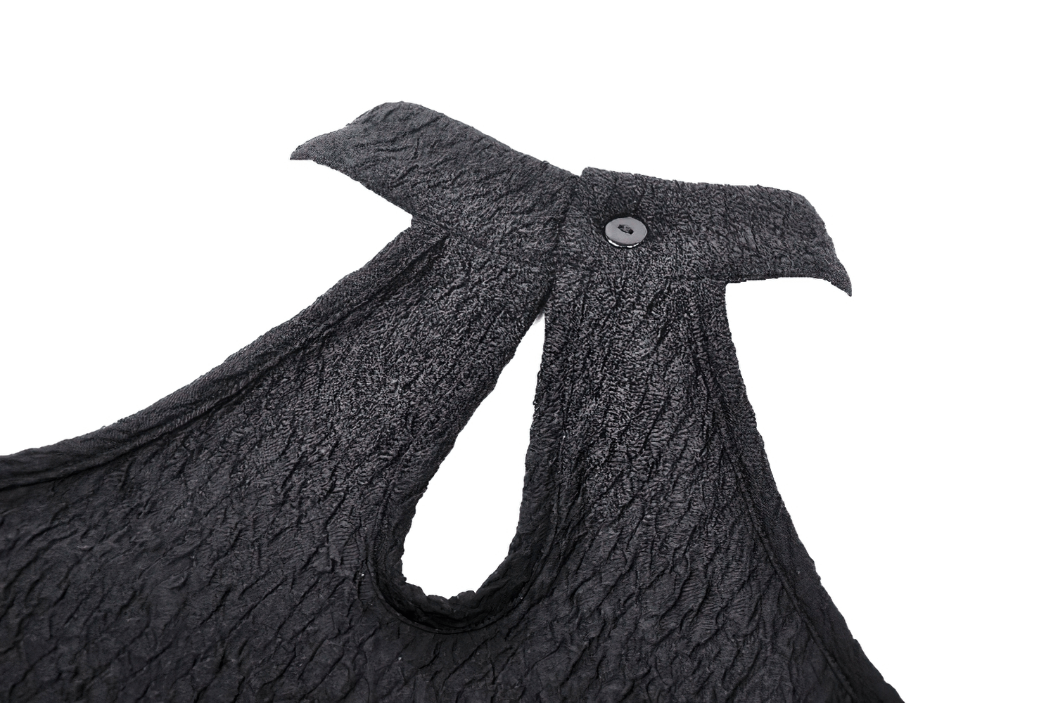 Close-up of stylish black lace top showcasing cutouts and button detail for a rockstar vibe.