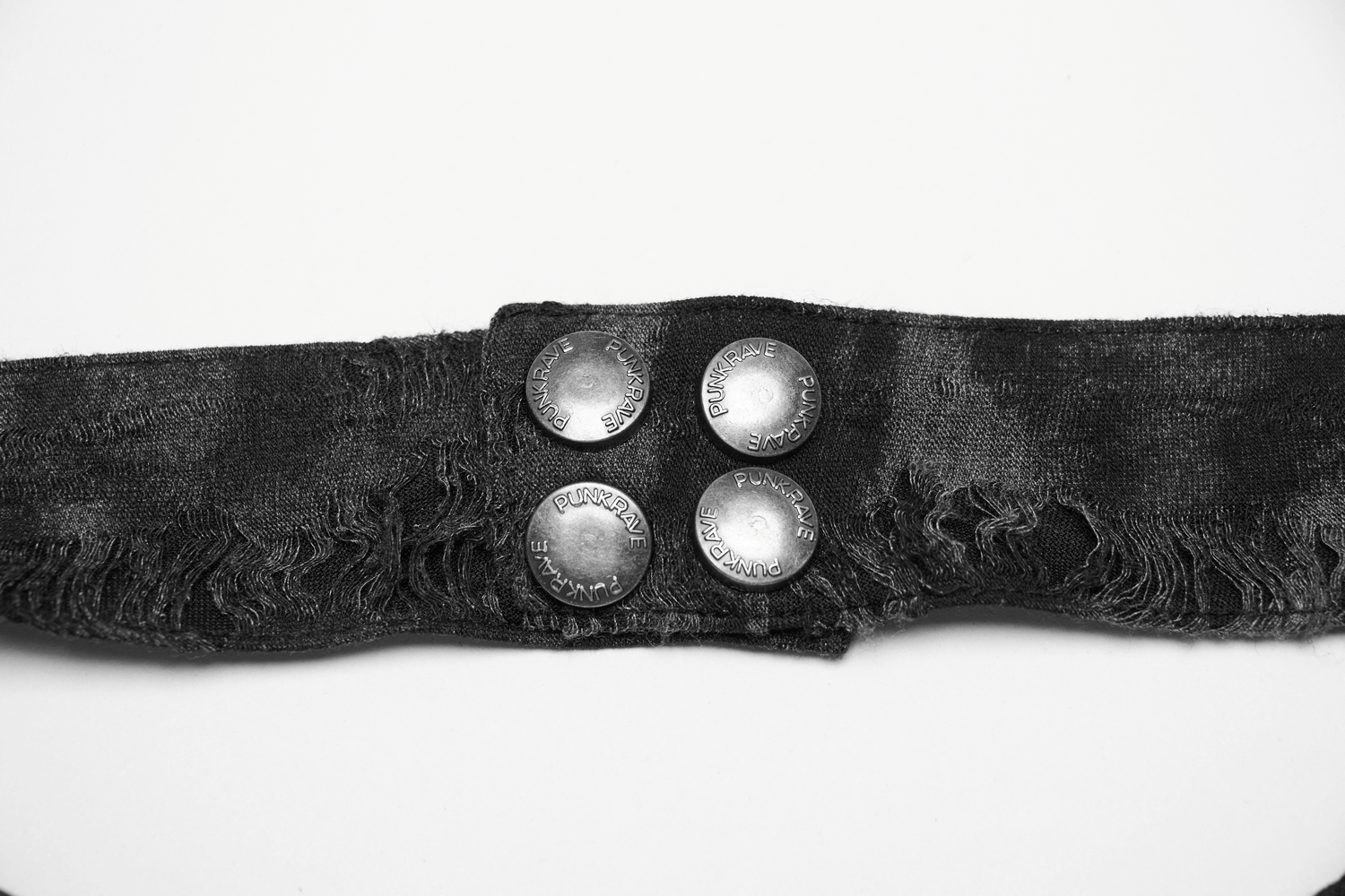 Close-up of a black distressed belt with metallic buttons, perfect for edgy, punk rock fashion styles.