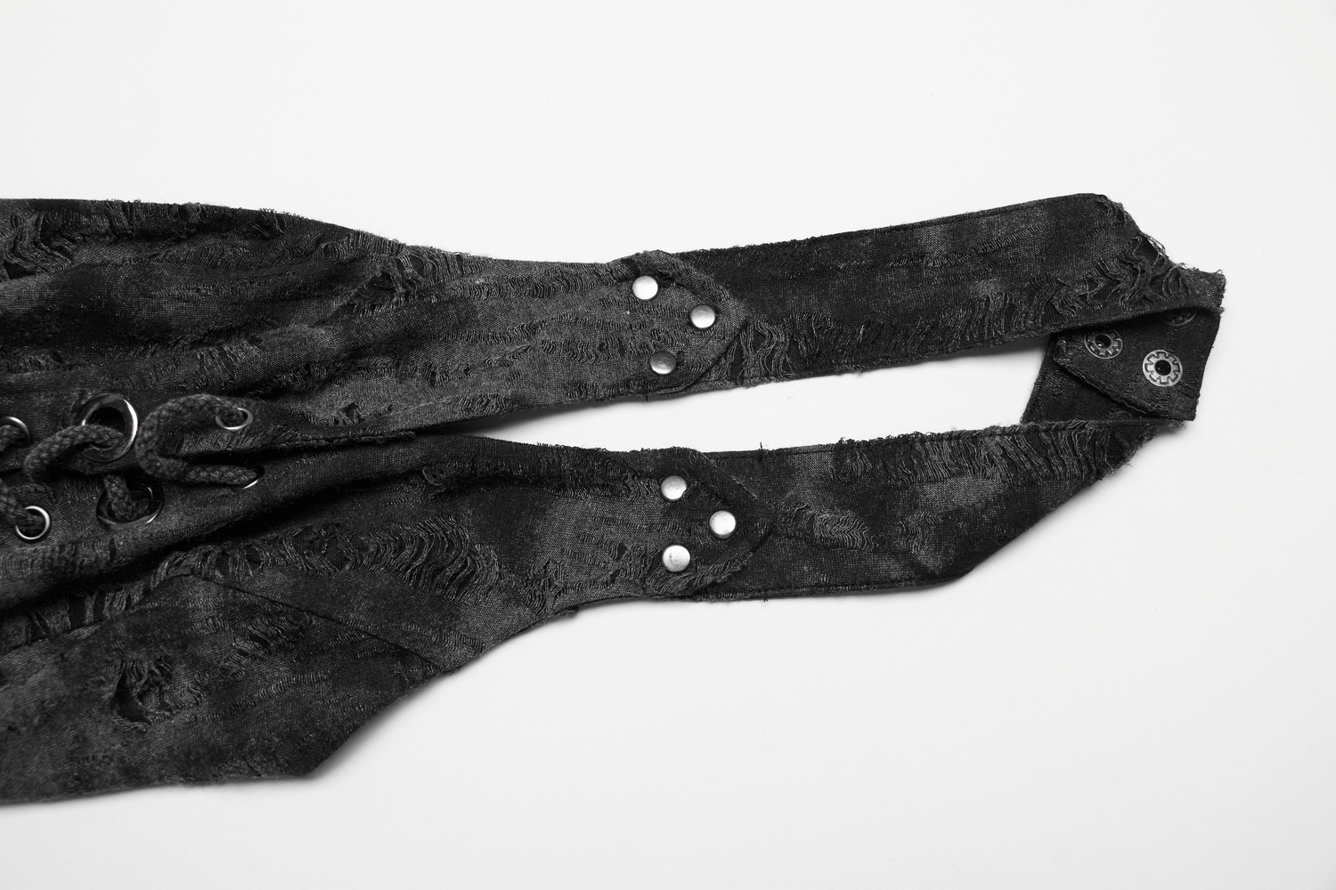 Close-up of stylish black lace-up halter top straps with distressed fabric and snap buckles for a rockstar look.