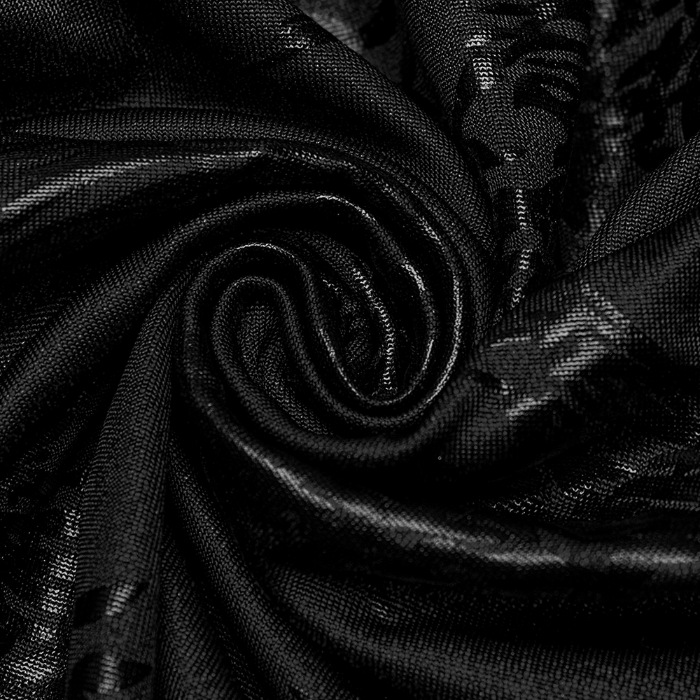 Close-up of stylish black fabric with a sparkling tree texture, perfect for edgy flared pants.