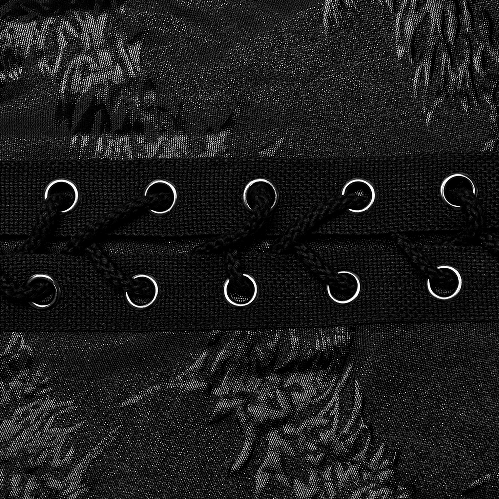 Close-up of stylish black lace-up detail on flared pants with sparkling tree texture.