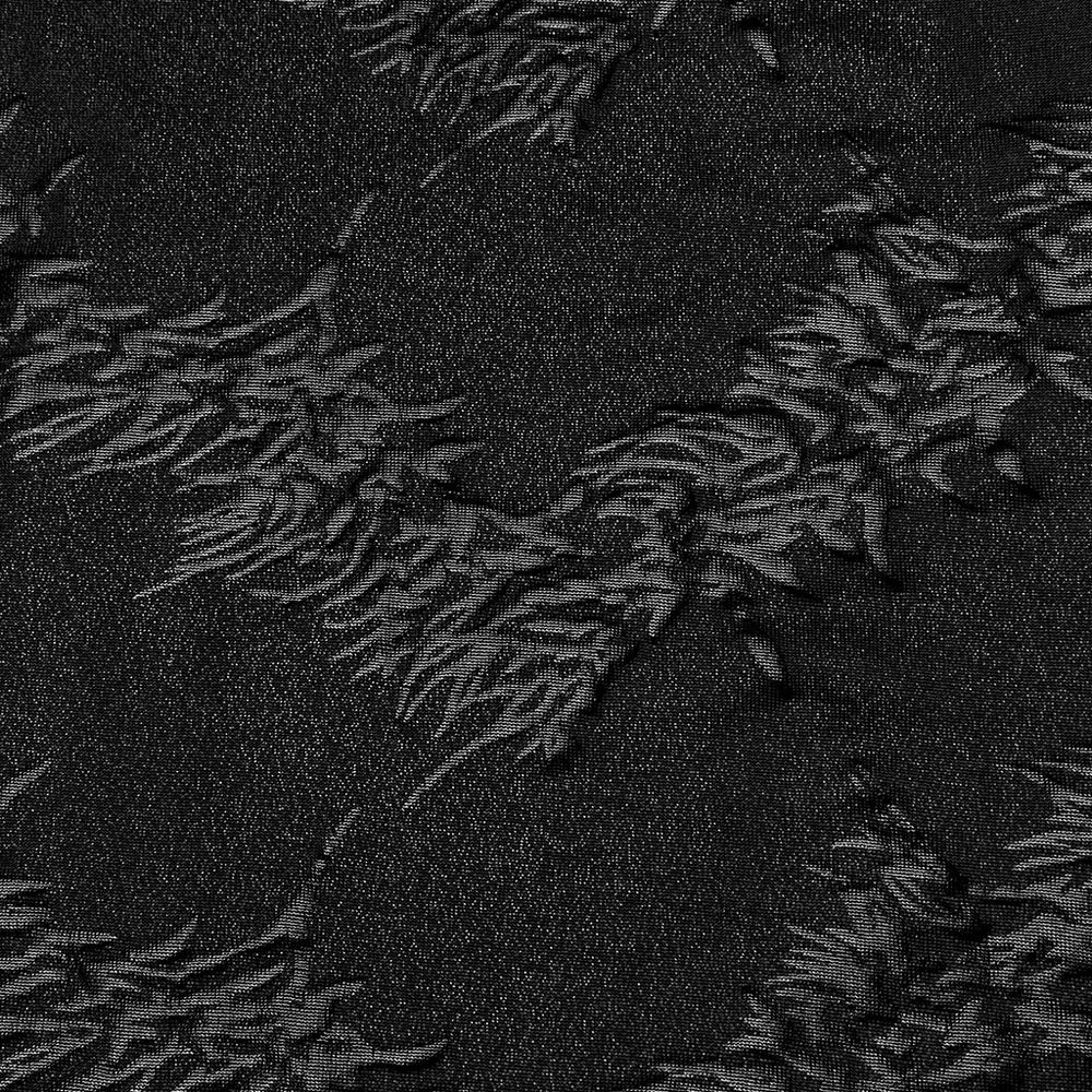 Close-up of sparkling black fabric with a unique tree texture, perfect for stylish flared pants.