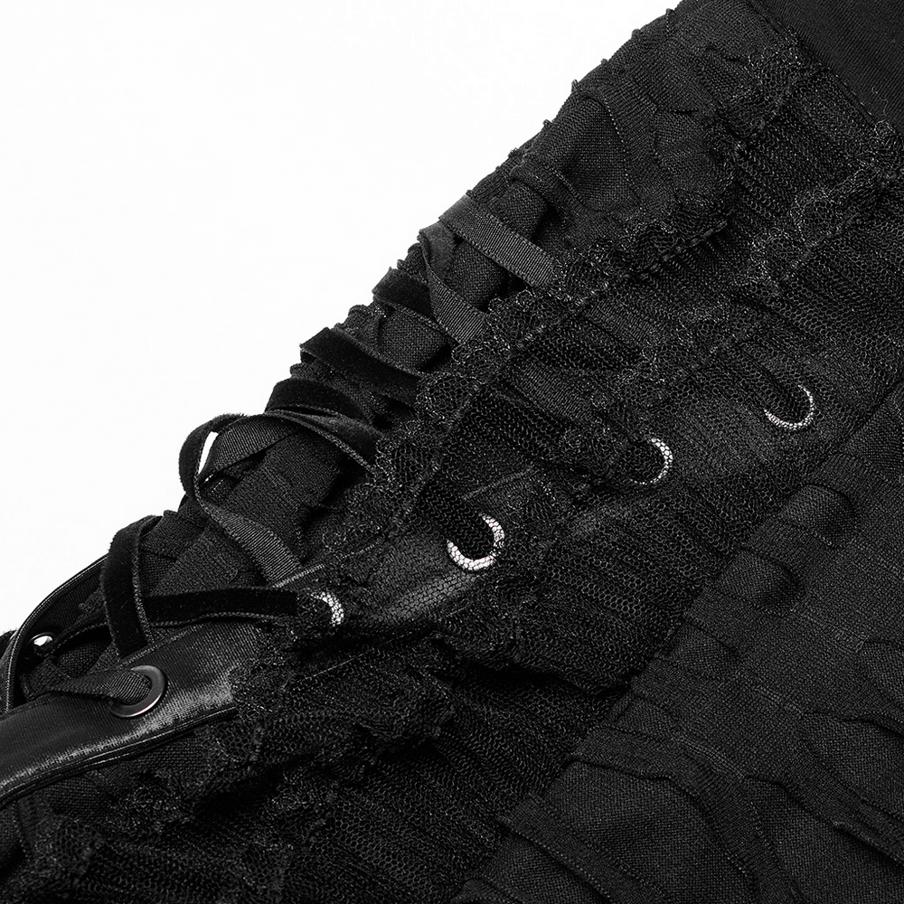 Close-up of a stylish gothic ruffle skirt showcasing lace-up detailing and textured fabric for an edgy look.