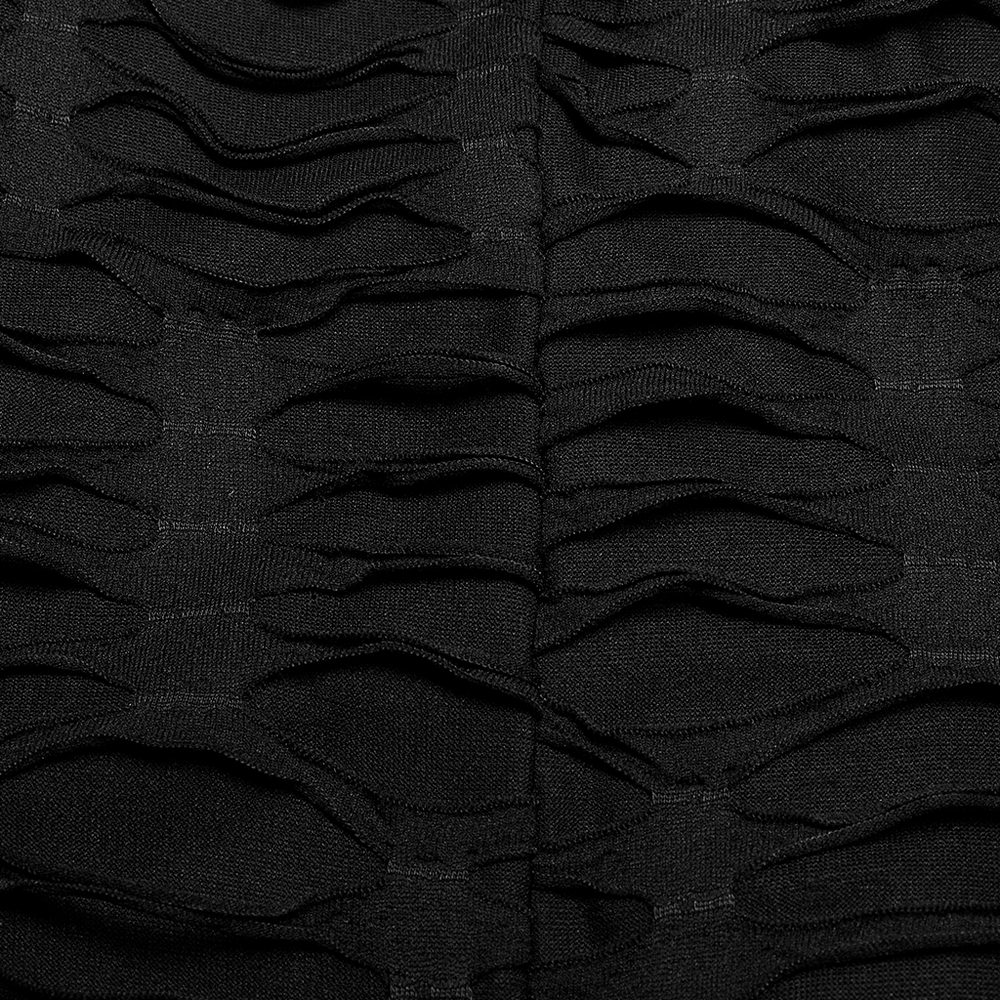 Close-up of the intricate layered ruffles on a stylish black gothic skirt, showcasing its unique texture and edgy design.