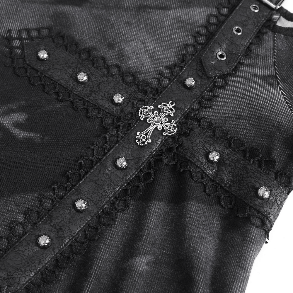 Close-up of punk women's long sleeves asymmetric top with buckle detail and decorative cross embellishment.