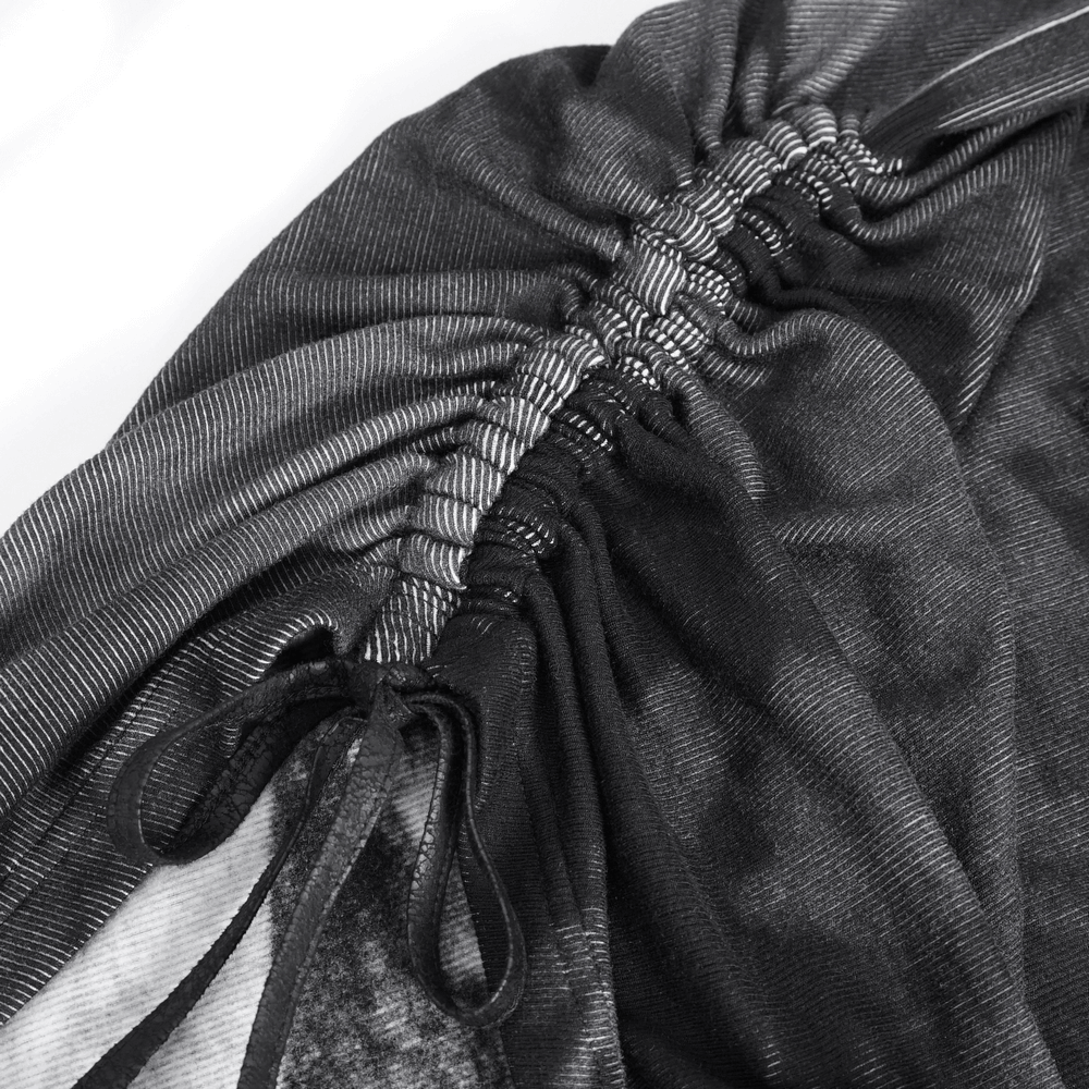 Detail of punk women's long sleeves asymmetric top showcasing the buckle and gathered fabric design.