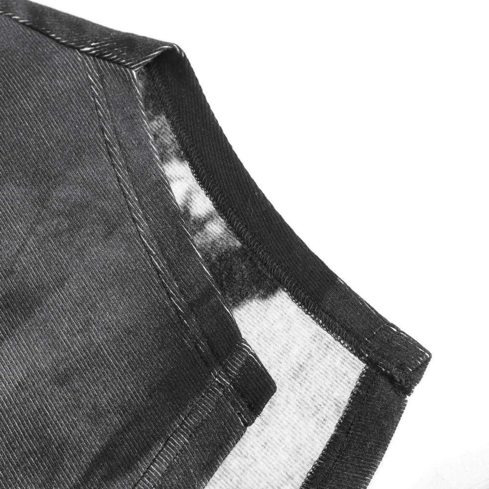 Close-up of the soft fabric and crewneck design of an asymmetric long-sleeve top with buckle detail.