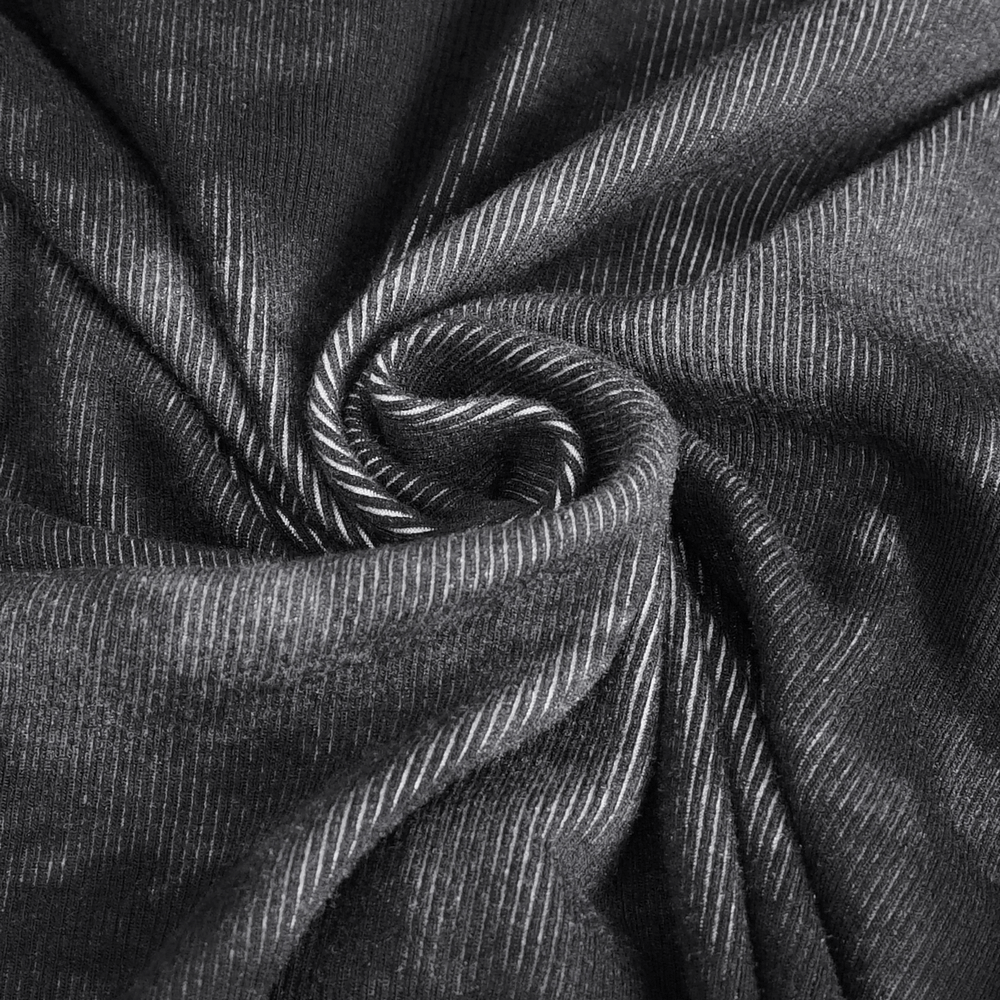 Close-up of soft black fabric with white pinstripes, showcasing its luxurious texture and drape.
