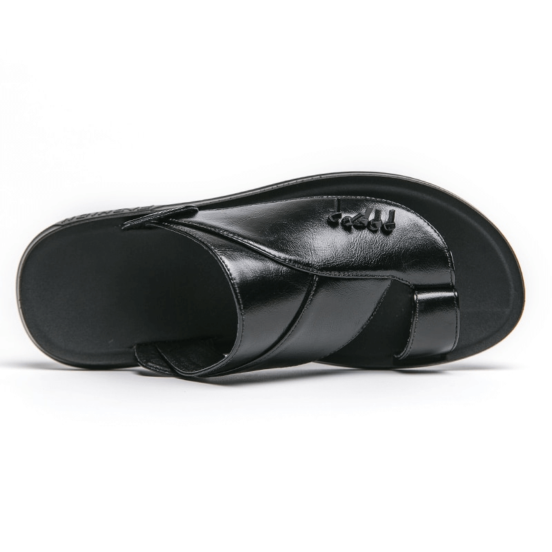 Stylish black PU leather slippers for men, perfect for casual and luxury wear. Modern design for laid-back elegance.