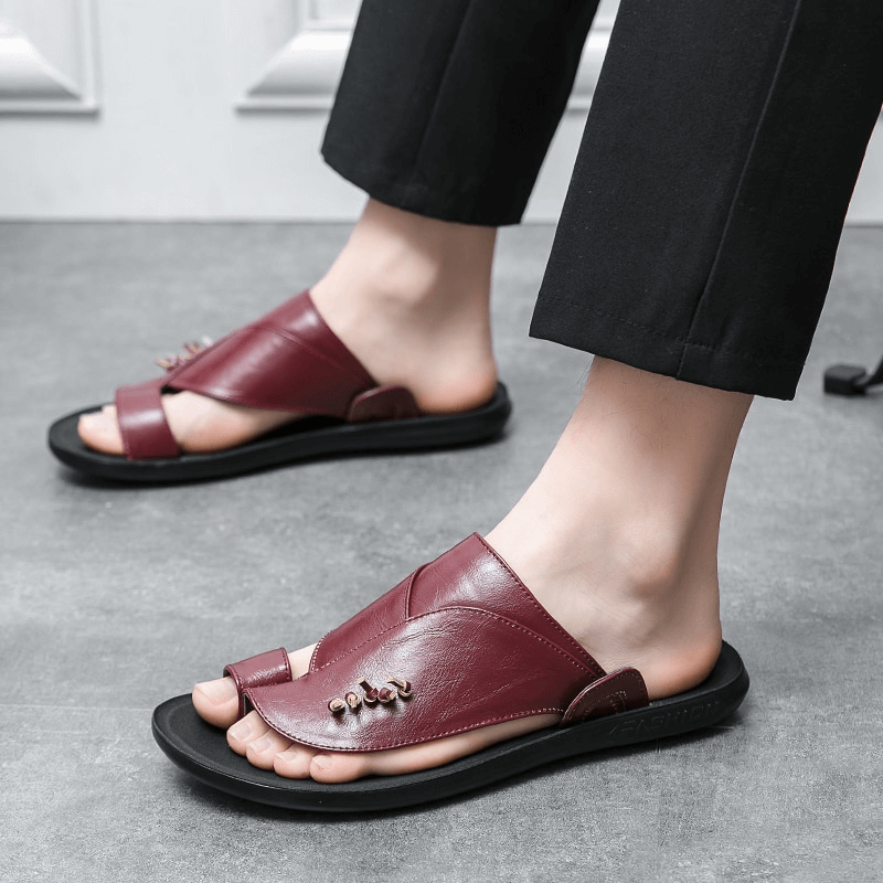 Stylish male PU leather slippers in burgundy, offering modern casual elegance and comfort for everyday wear.