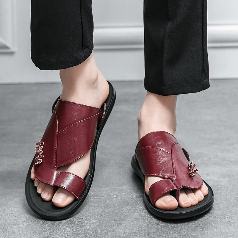Stylish male PU leather slippers in burgundy, combining comfort and elegance for casual outings and home relaxation.