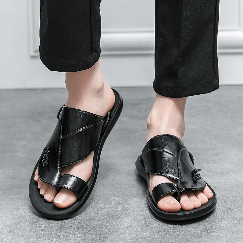 Stylish male PU leather slippers in black, perfect luxury flip-flops for casual and modern fashion.