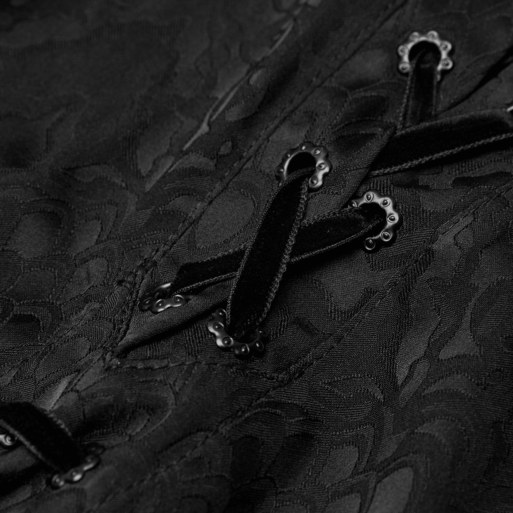 Close-up of stylish lace-up detail on a gothic jacquard shirt with intricate metal buckles.