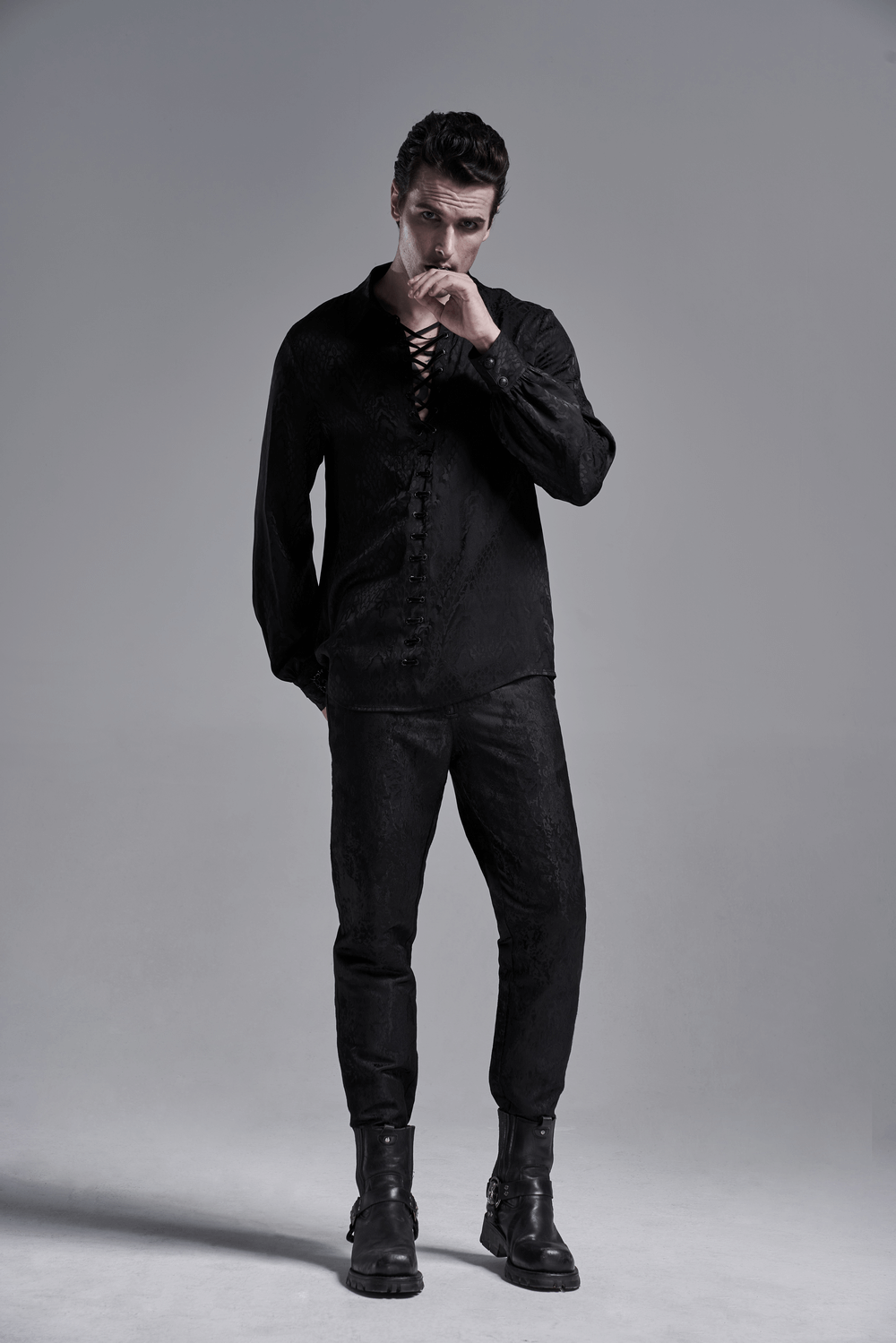 Stylish black men's gothic jacquard shirt with lace-up design and vintage charm, complemented by fitted pants.