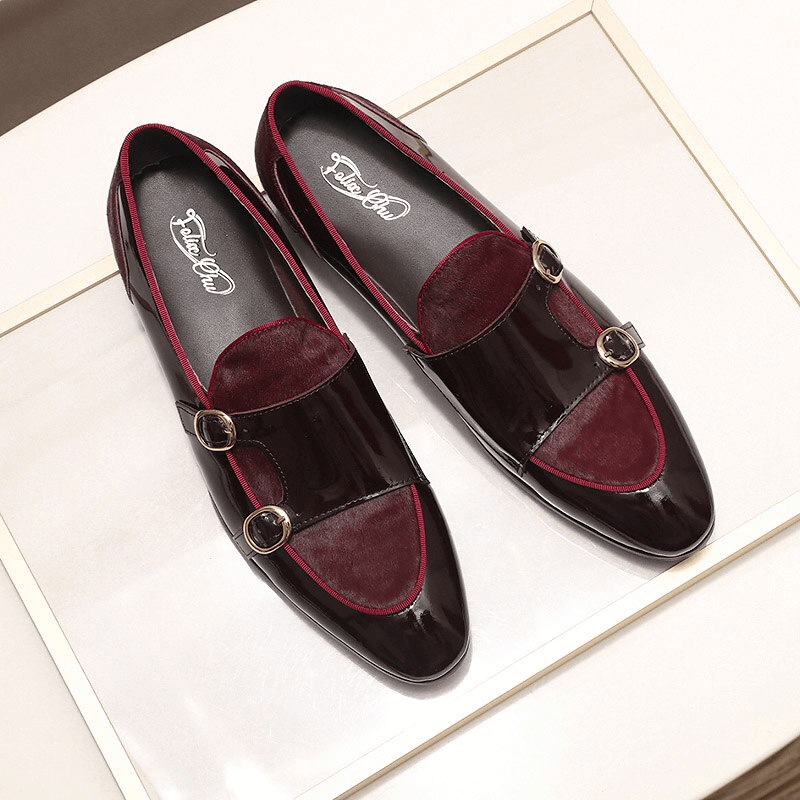 Stylish men's patent leather loafers with double buckle design in sleek burgundy finish.