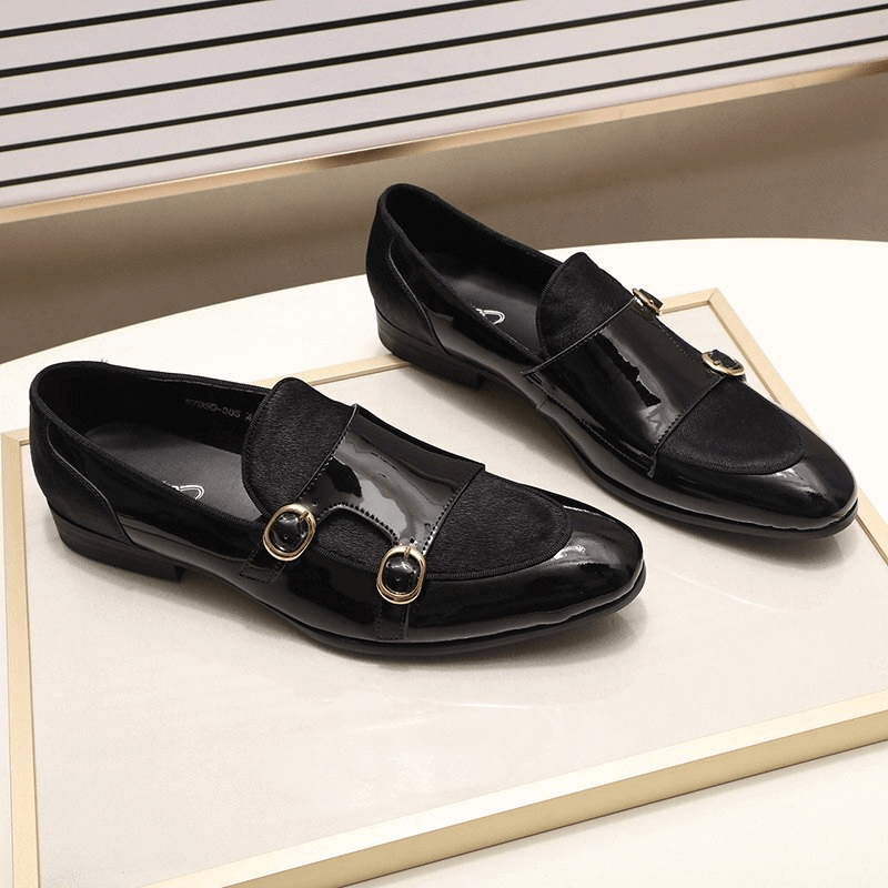 Stylish men's black patent leather loafers with double buckles, perfect blend of casual and sophisticated footwear.