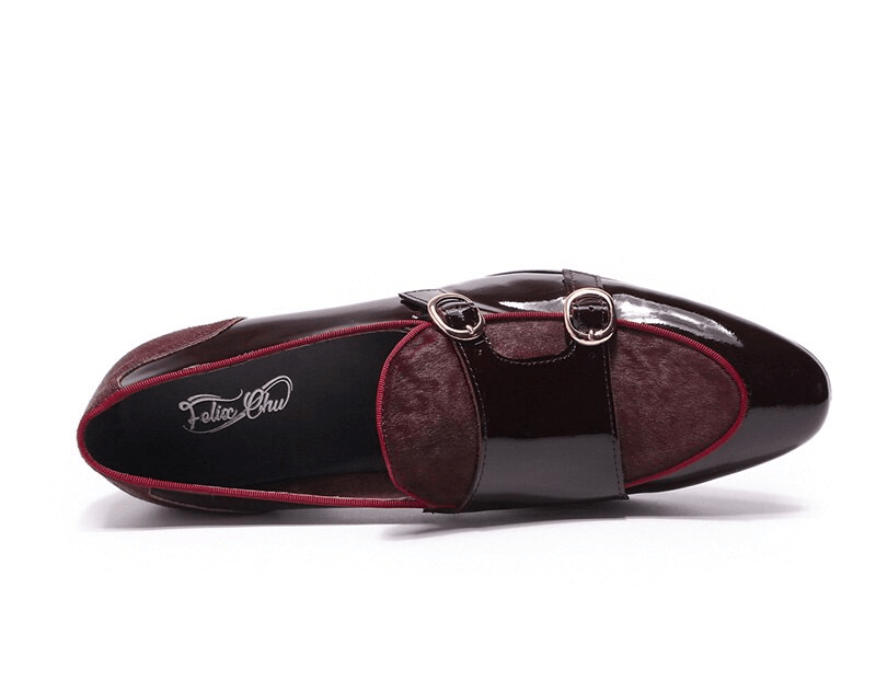 Stylish men's patent leather loafers with double buckles for a refined casual look.