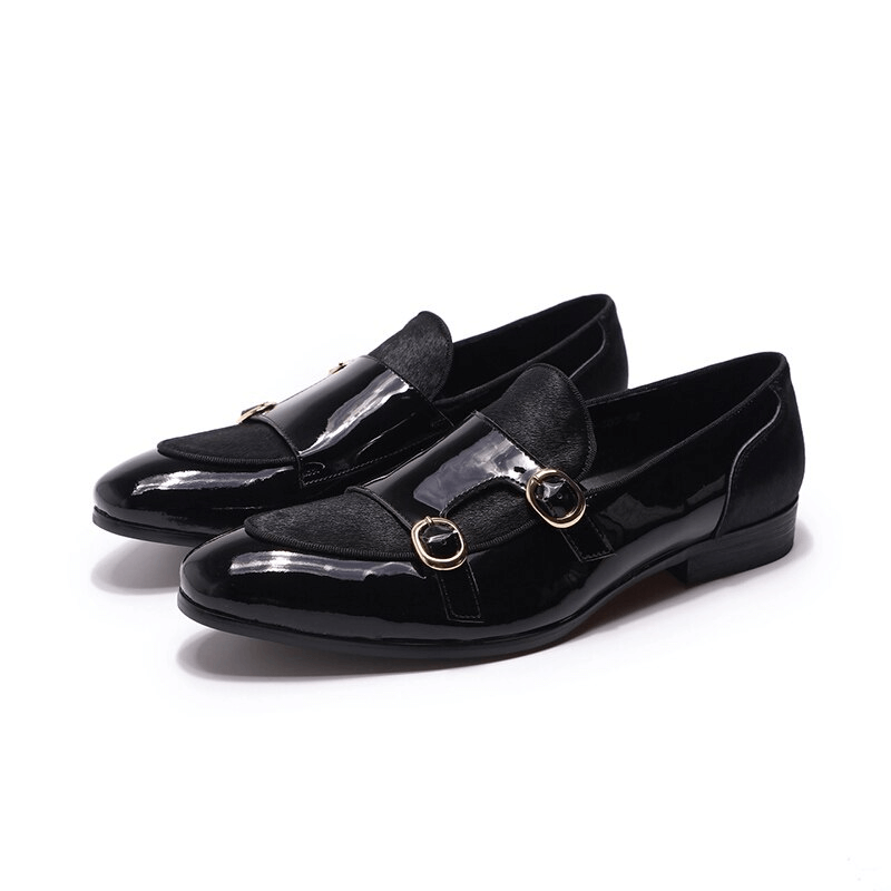 Stylish black patent leather loafers for men featuring double buckles, perfect for casual or smart occasions.
