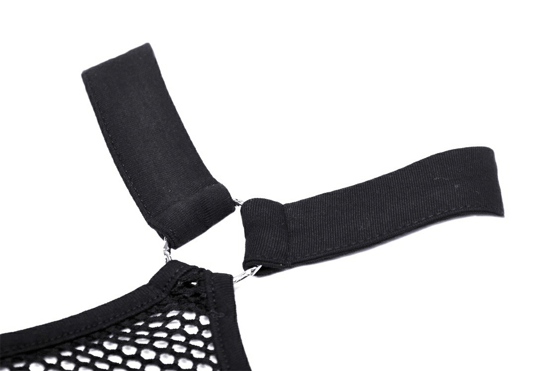 Close-up of halter straps on a stylish mesh crop top with metal eyelets and net panels.