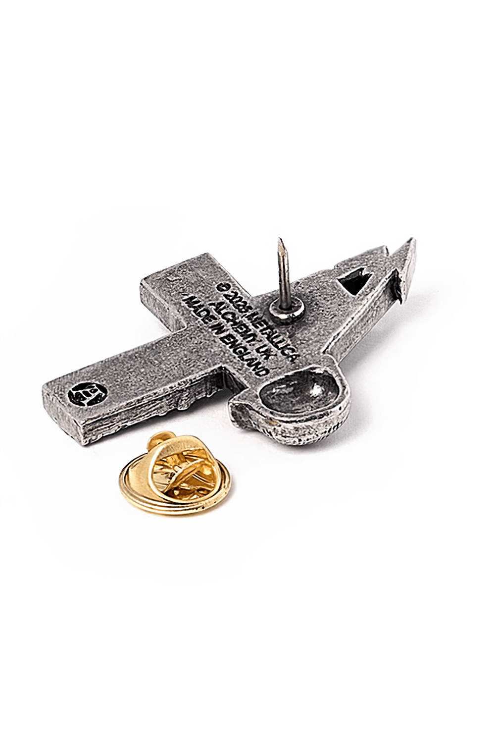 Stylish Metallica Master of Puppets pewter pin badge with gold clasp, showcasing iconic album artwork.