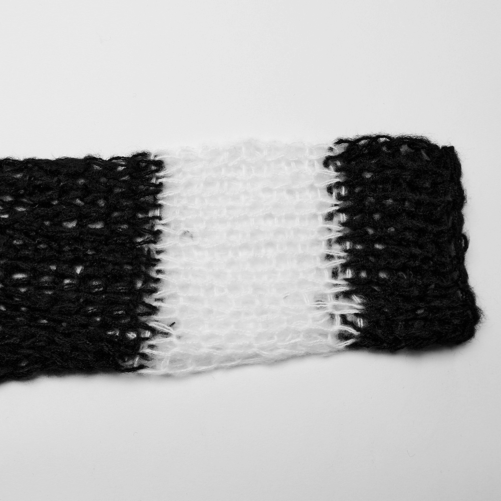 Chunky mohair striped fabric showcasing black and white color contrasts with an edgy, textured design.