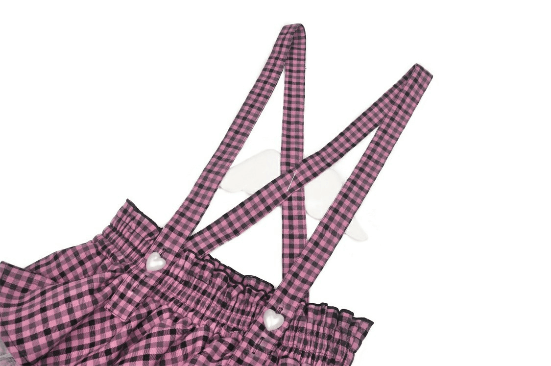 Stylish pink checkered skirt straps with lace trim for a trendy, playful fashion look.
