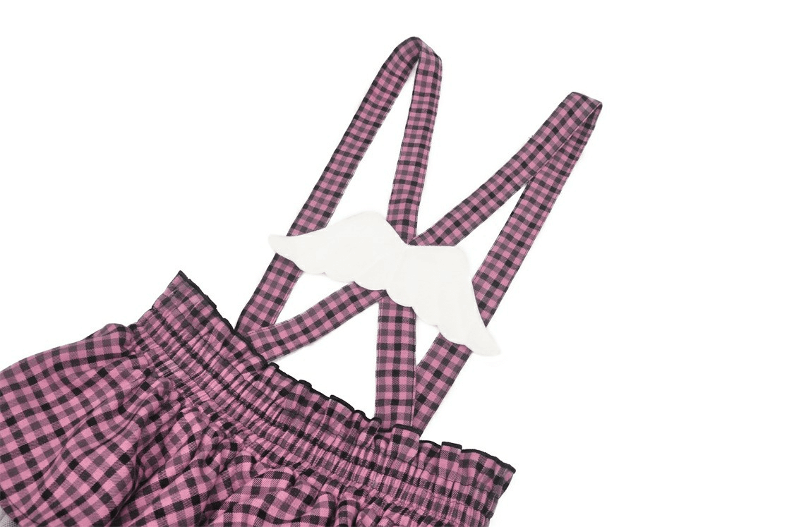 Stylish pink plaid skirt straps with trendy lace details and playful ruffles, perfect for mixing styles.