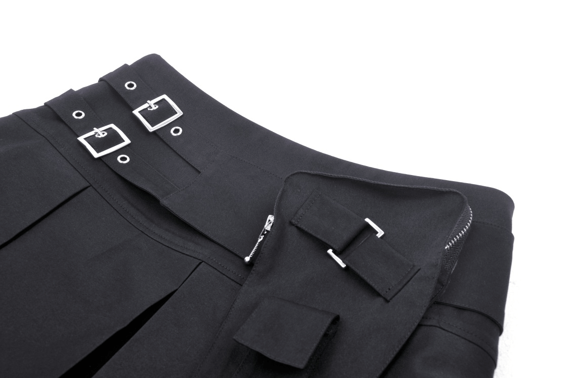 Black pleated mini skirt with punk rock buckle detail and side pocket for an edgy everyday look.