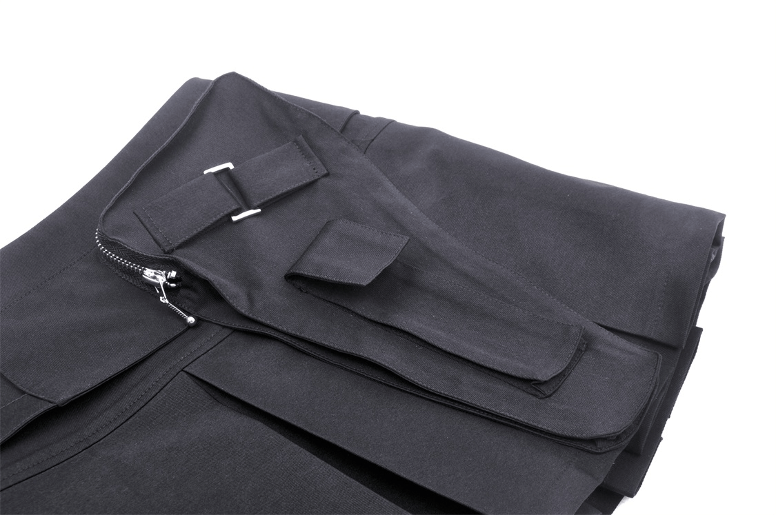 Close-up of stylish black pleated mini skirt with punk rock buckle detail and functional side pocket.