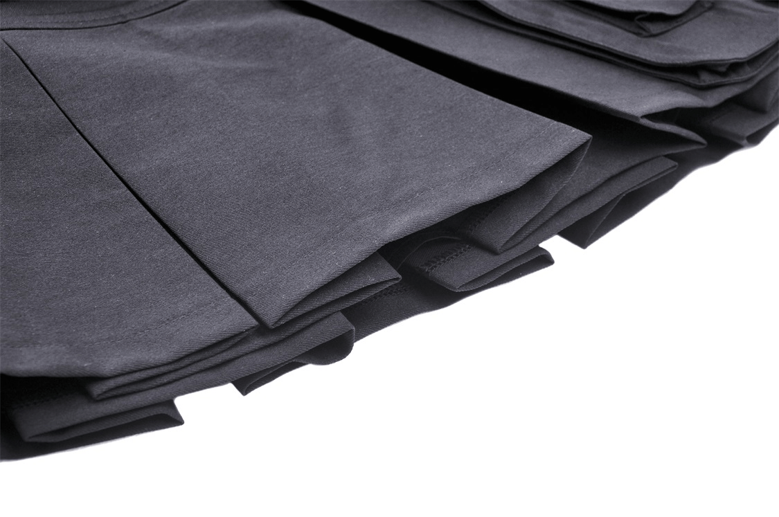 Stylish black pleated mini skirt showcasing edgy folds and detailing for a fierce fashion statement.