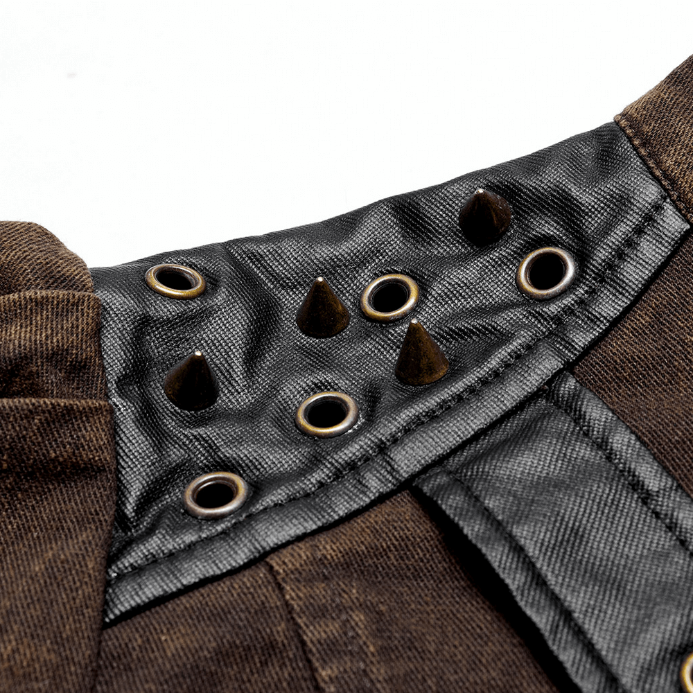 Close-up of stylish punk jacket collar showcasing eyelets and spikes, highlighting edgy faux leather design.