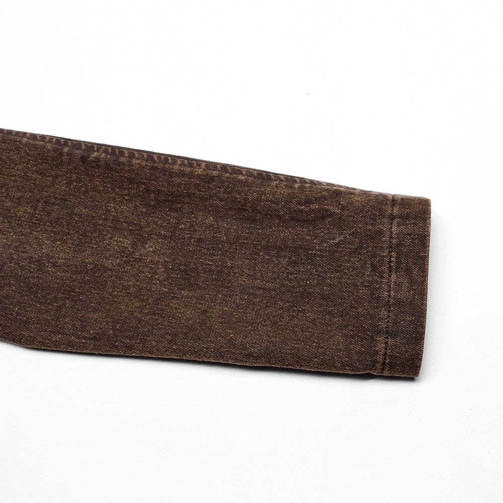 Close-up of a stylish brown denim jacket sleeve showcasing texture and stitching detail.