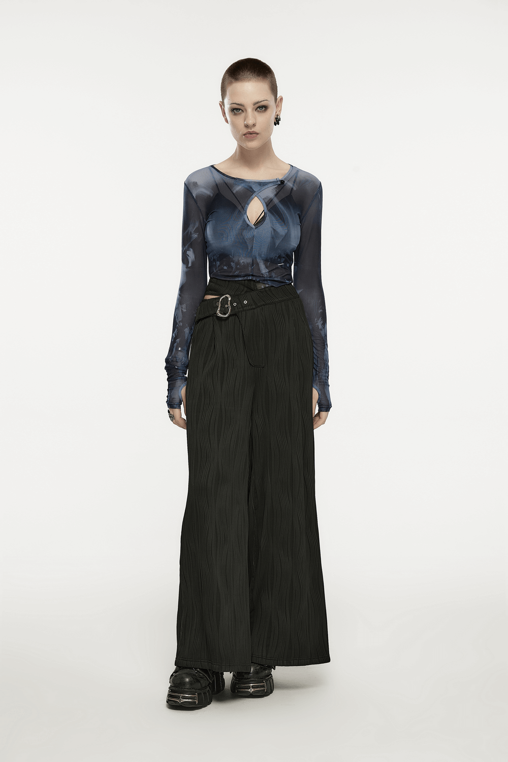 Model wearing stylish punk black asymmetrical buckle wide-leg pants with a blue top, showcasing edgy fashion.