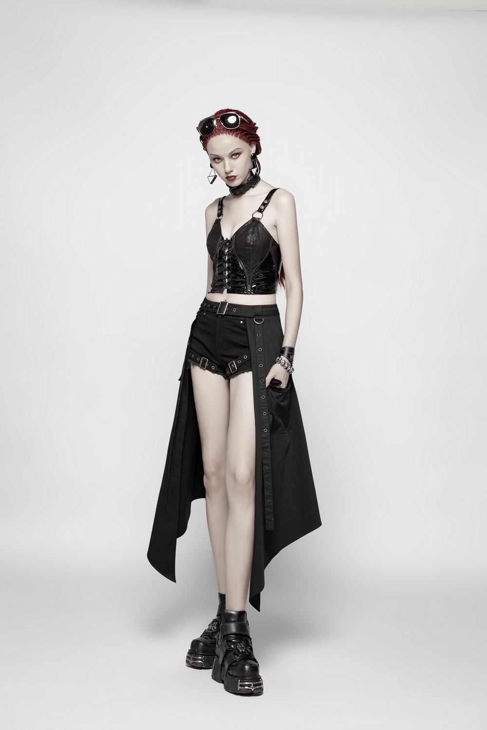 Model showcasing a stylish punk black asymmetrical cargo mini skirt with edgy accessories and bold look.