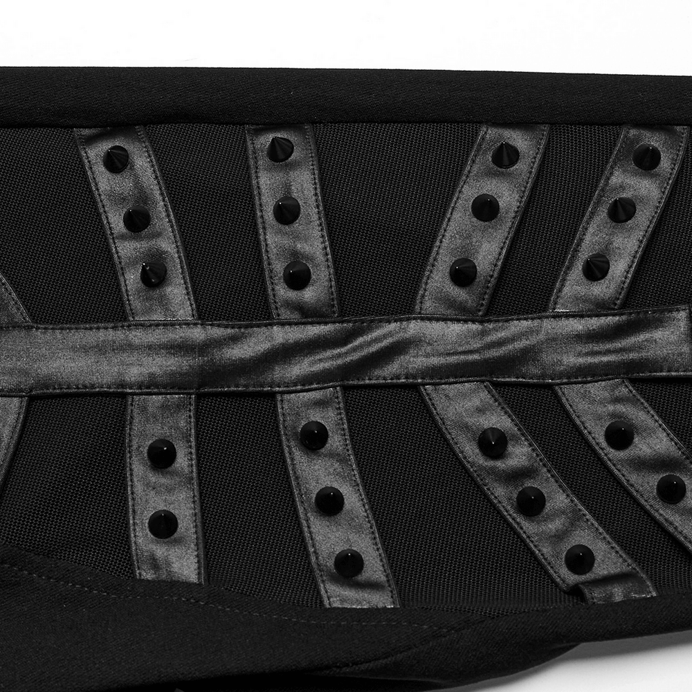 Close-up of black mesh panel leggings featuring spiral studded horizontal tab decoration for a punk rock style.