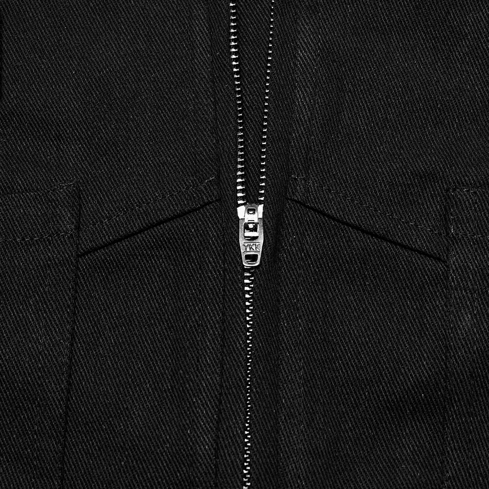 Close-up of a stylish black zipper on a mini skirt, showcasing sleek metal detailing for a punk rock vibe.
