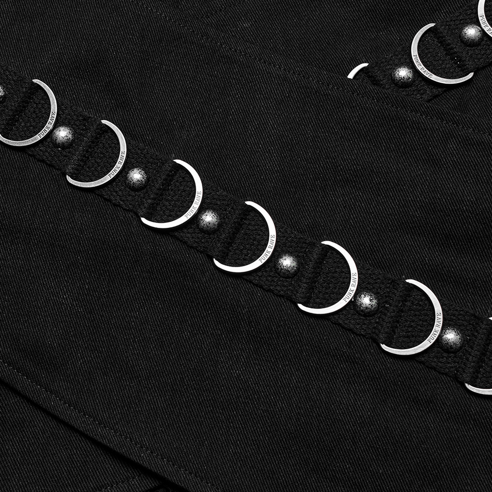 Close-up of stylish punk black mini skirt showcasing metal rings and studs details for a rebellious edge.