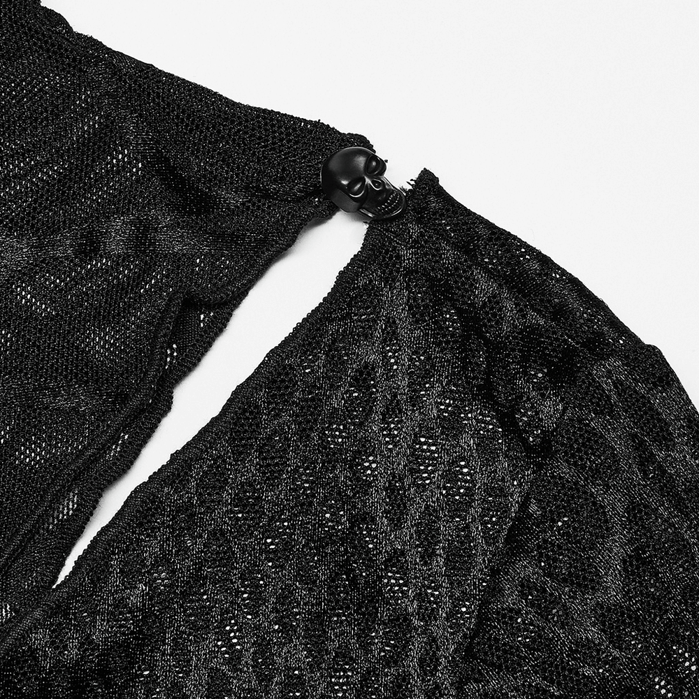 Close-up of black spiderweb mesh fabric with skull detail, showcasing edgy punk style and decorative hollow-out design.
