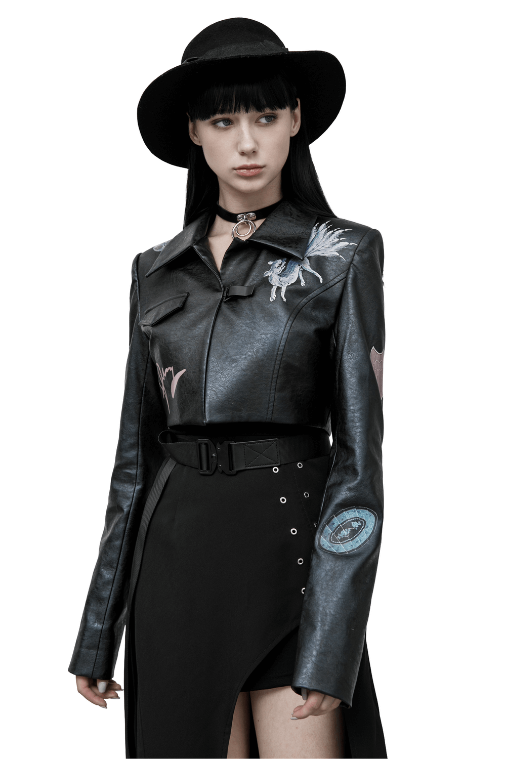 Stylish punk cropped leather jacket with unique prints, worn by a model in edgy fashion attire.