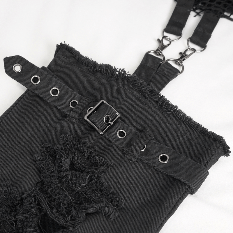 Close-up of stylish black punk pants with detachable design, featuring rough edges and metal details for edgy fashion.