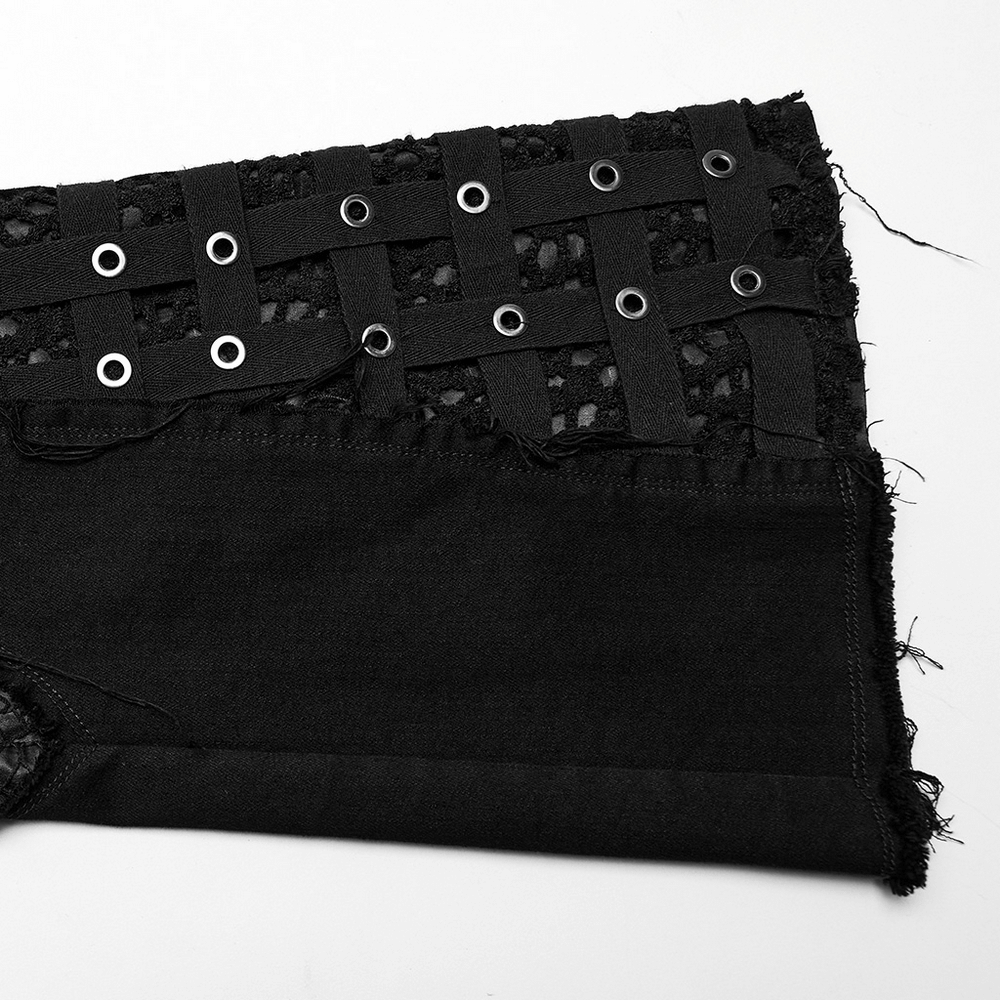 Close-up of stylish punk mesh-insert denim with eyelet details, showcasing gothic style and edgy design.