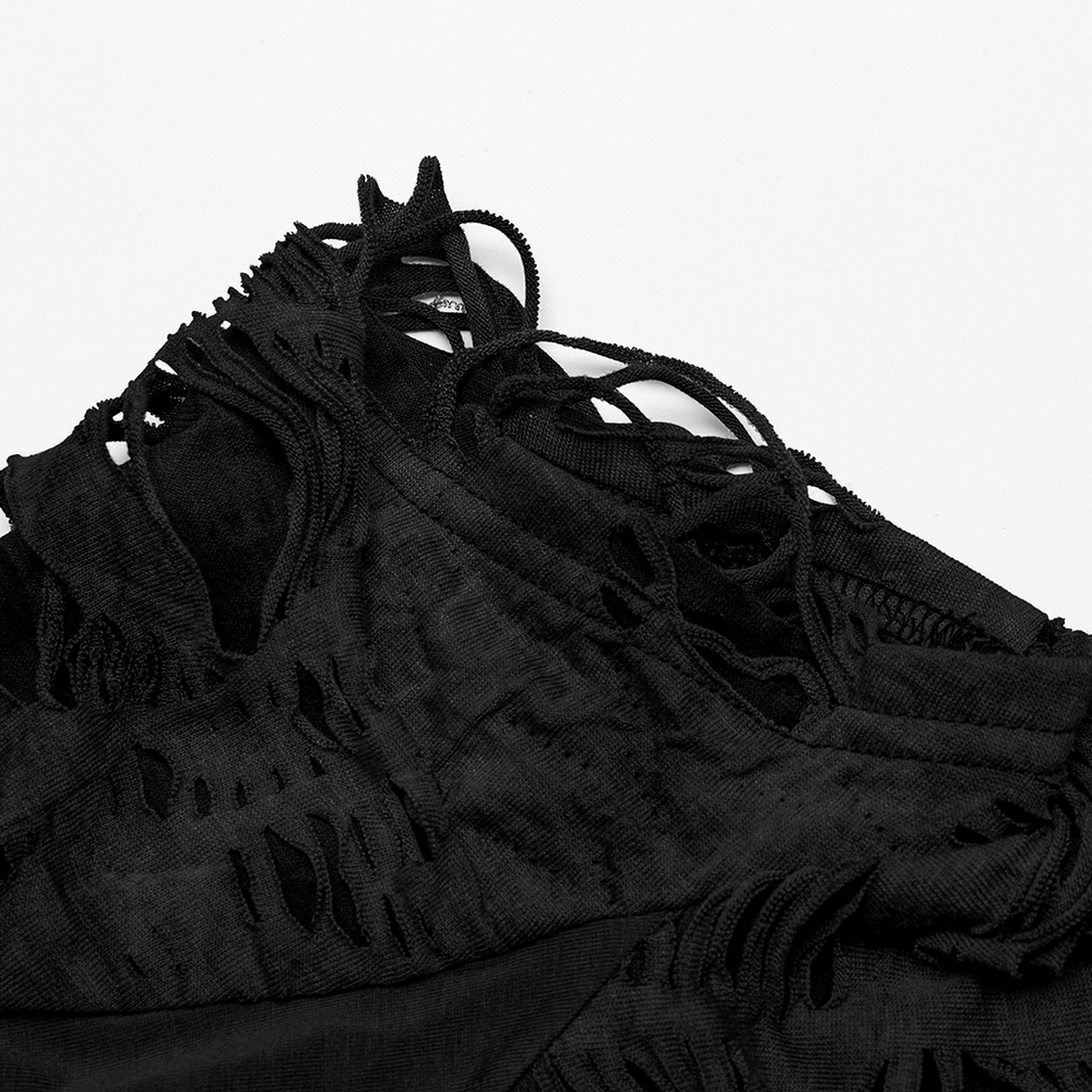 Close-up of a stylish black ripped t-shirt showcasing unique cross-cut designs and a tattered punk aesthetic.