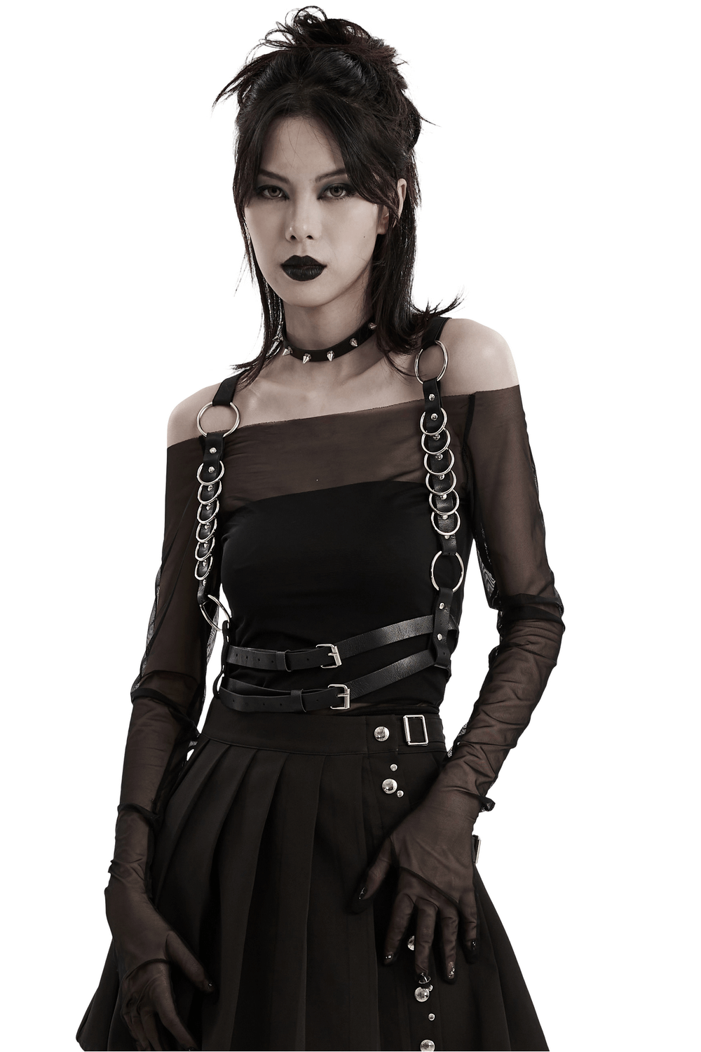 Edgy model wearing a stylish punk harness with metal rings and adjustable straps, showcasing bold, alternative fashion.