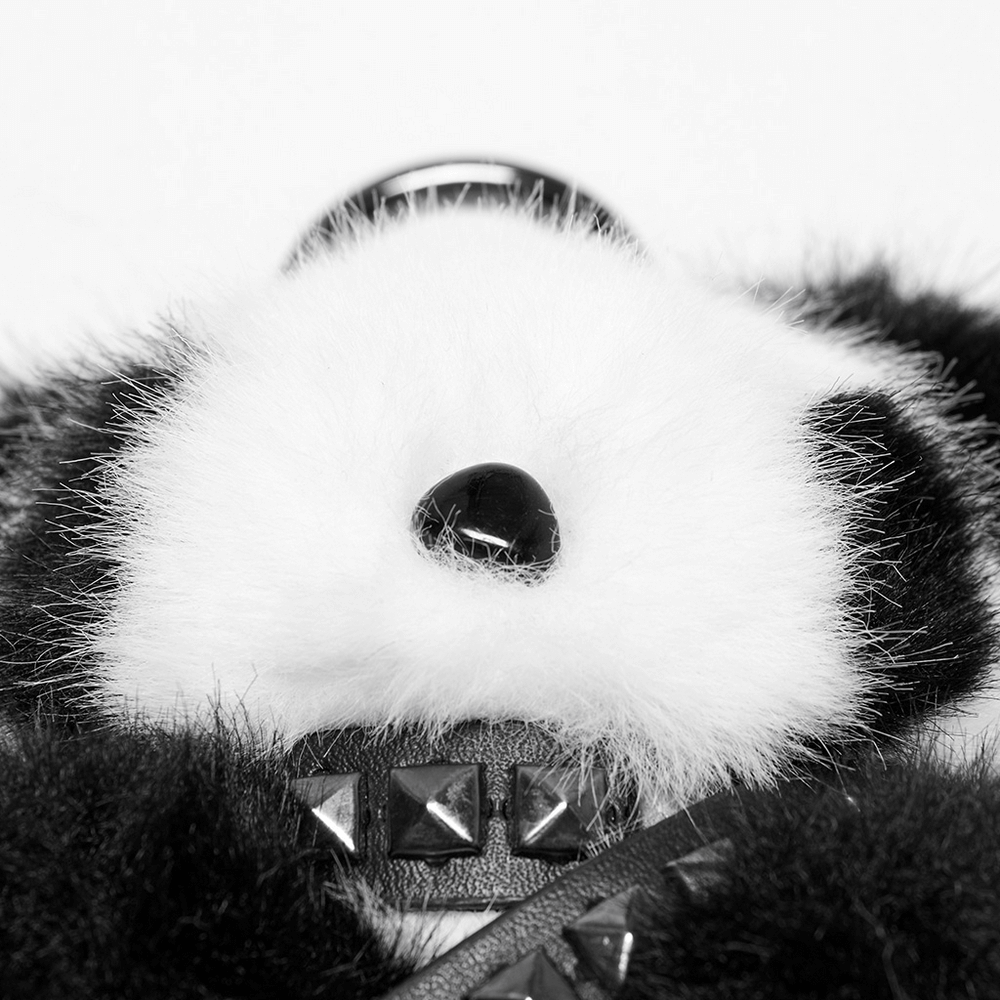 Close-up of a stylish punk panda keychain featuring plush faux fur and studded detail. Perfect for bags and keys!