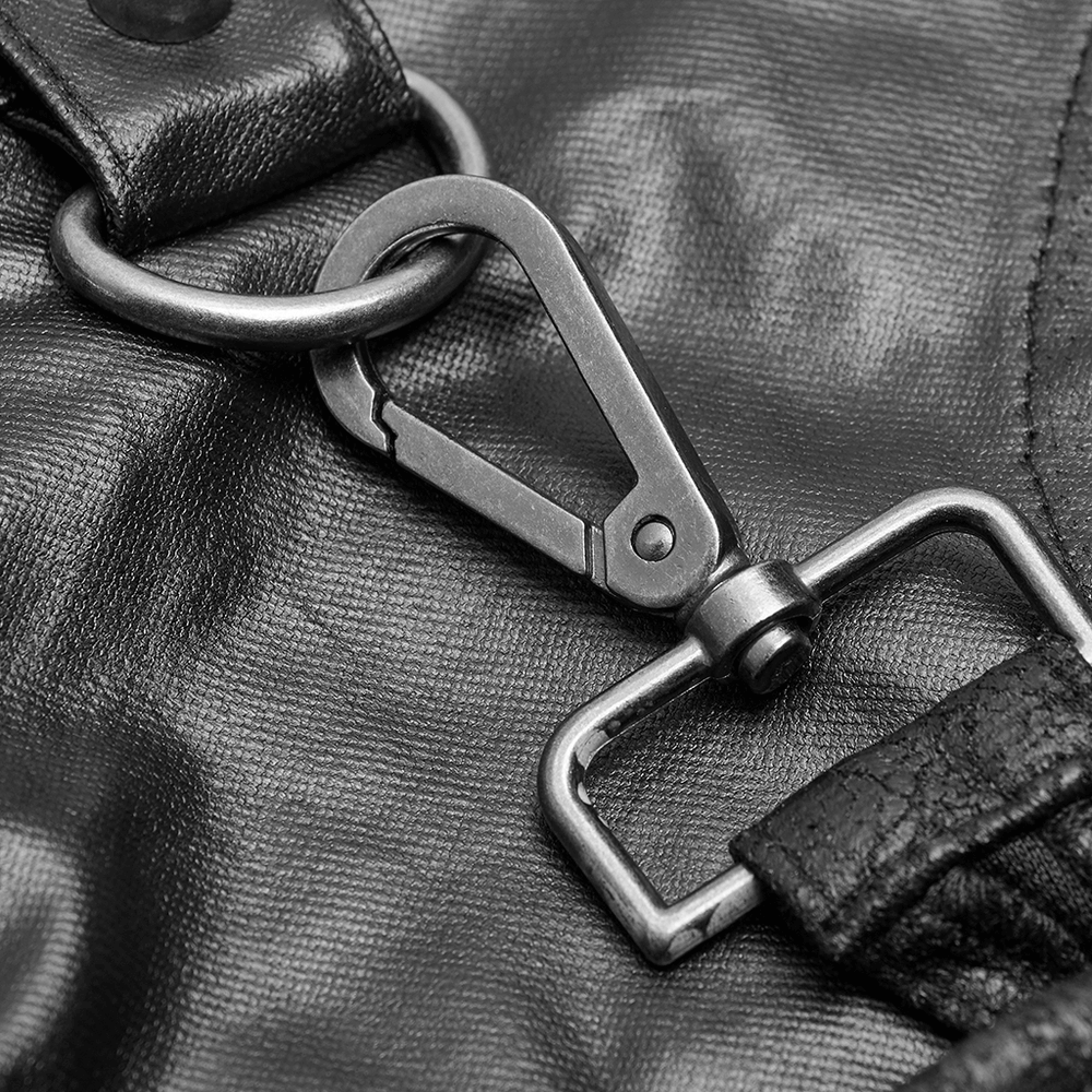 Close-up of a black metal clip and buckle on a stylish punk kilt skirt, showcasing edgy details.