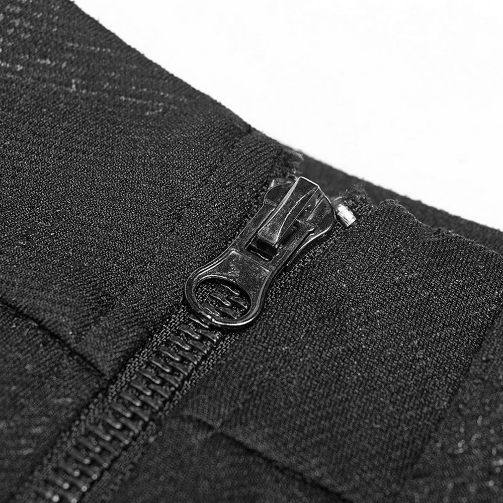 Close-up of a black zipper on a punk rave mini skirt, showcasing its sleek design and edgy details.