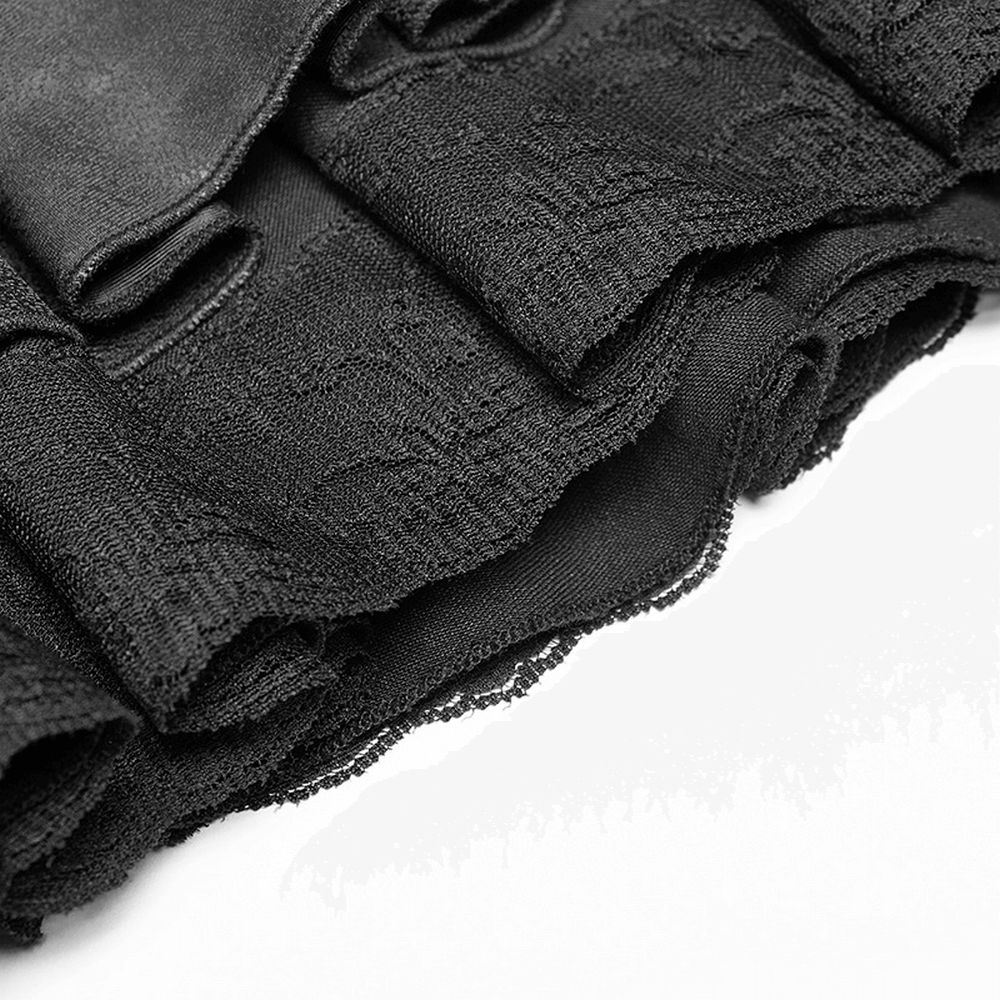 Close-up of ruffled lace trim on a stylish black punk rave mini skirt.